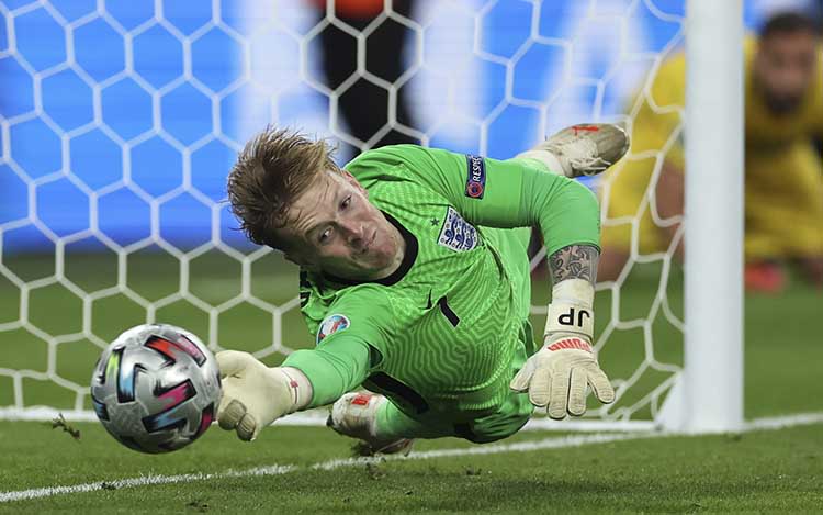 England's Jordan Pickford saves Jorginho's penalty in the EURO 2020 shootout at Wembley