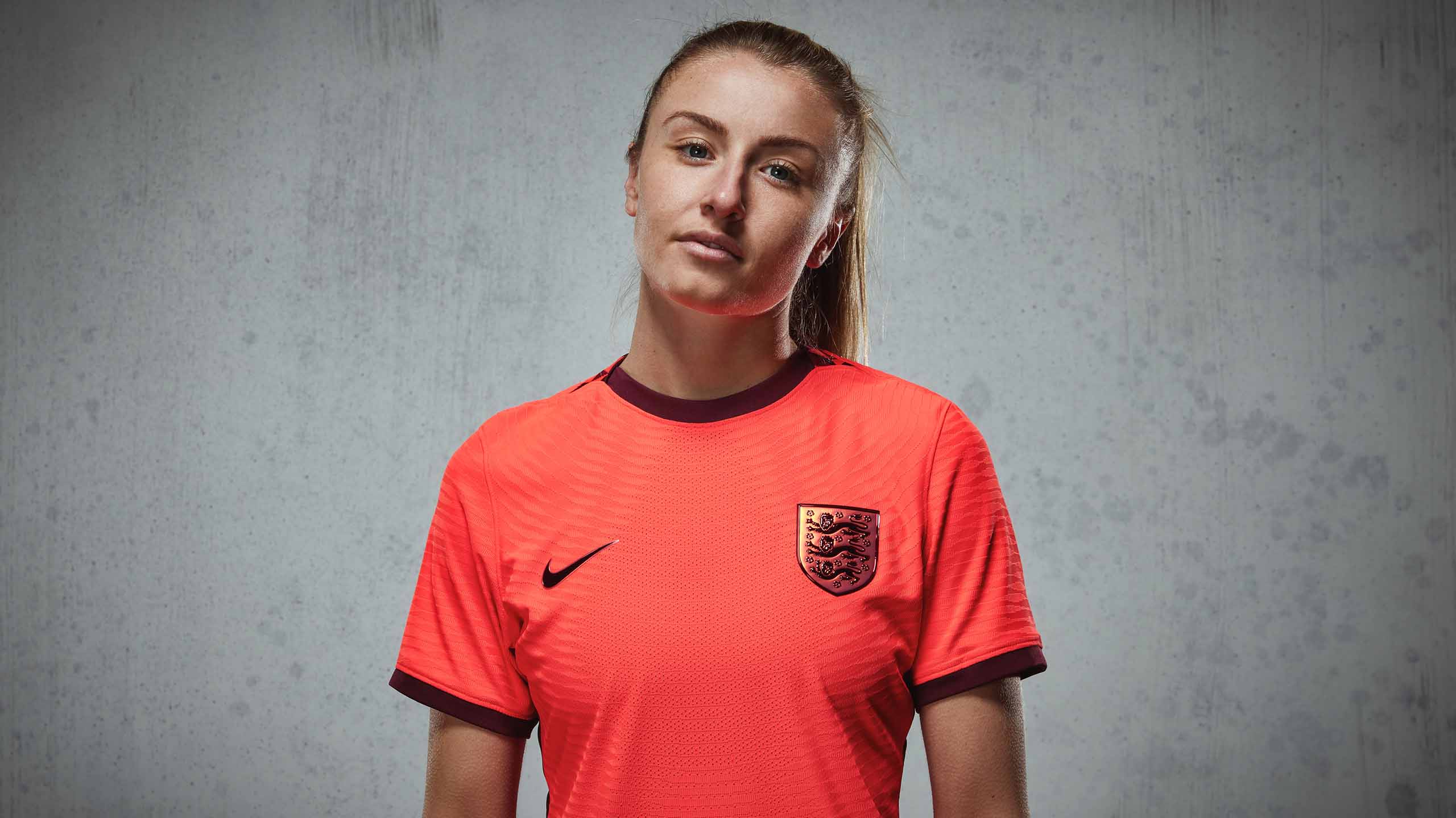 Leah Williamson models the new England Women's home kit