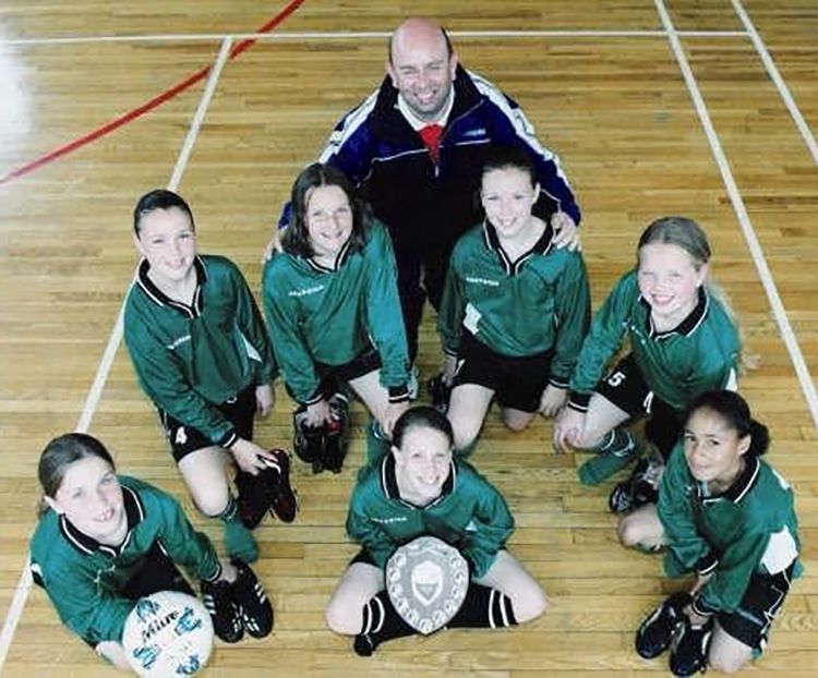 Demi Stokes with an early football team