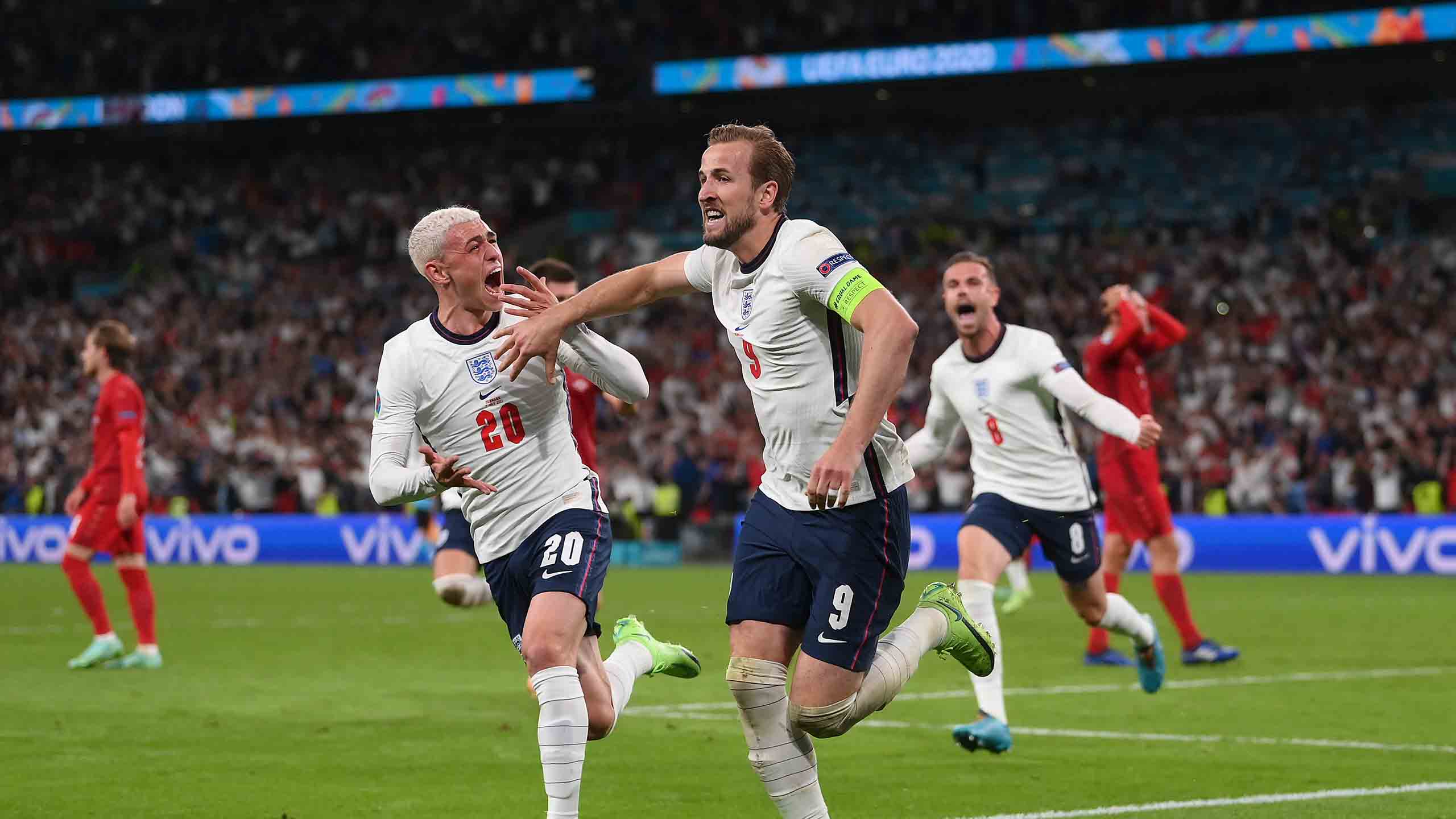 Phil Foden and Harry Kane celebrating during the EURO 2020 semi final win over Denmark