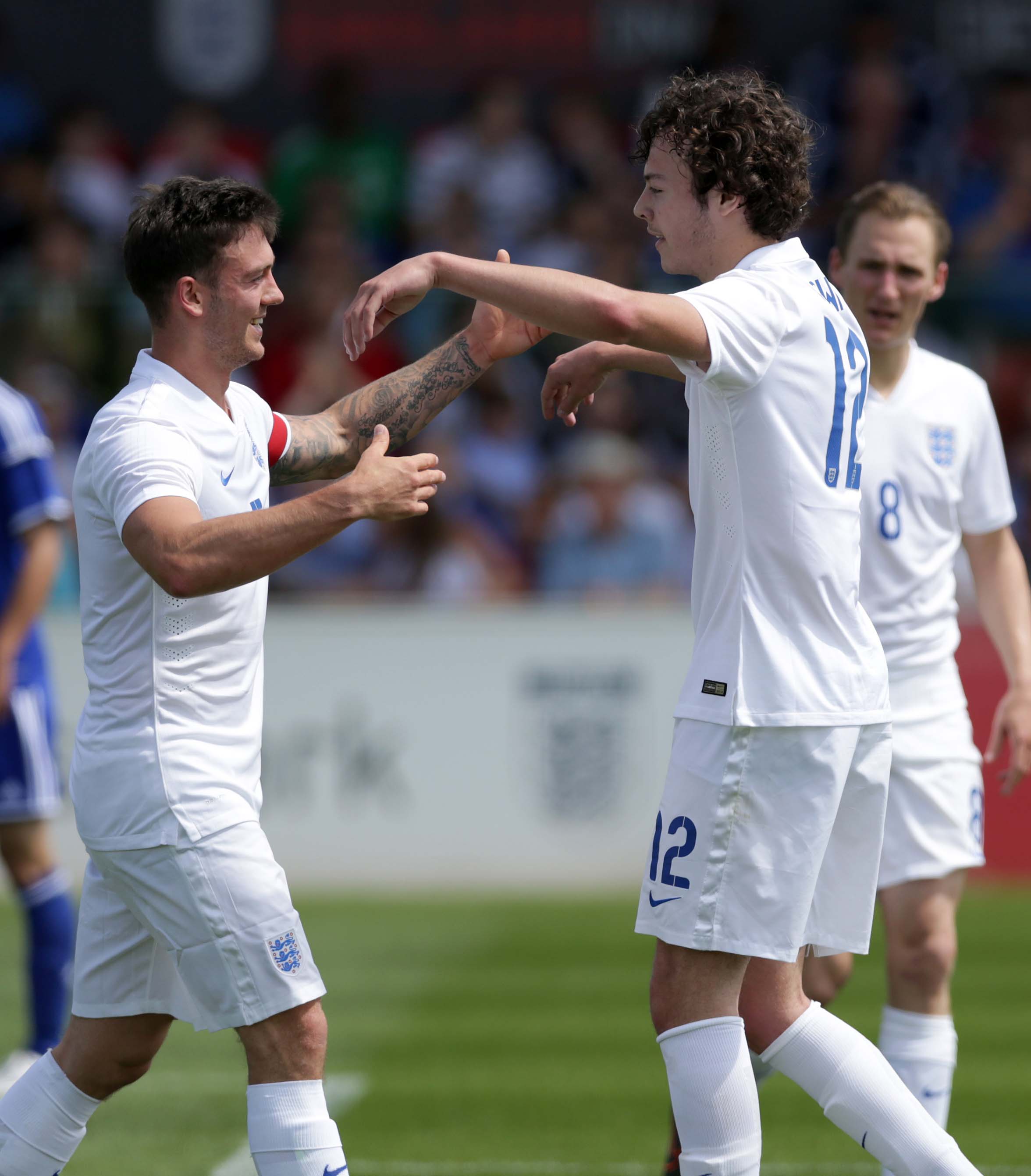 Jake Brown celebrating a goal with the Para Lions alongside England CP legend Jack Rutter